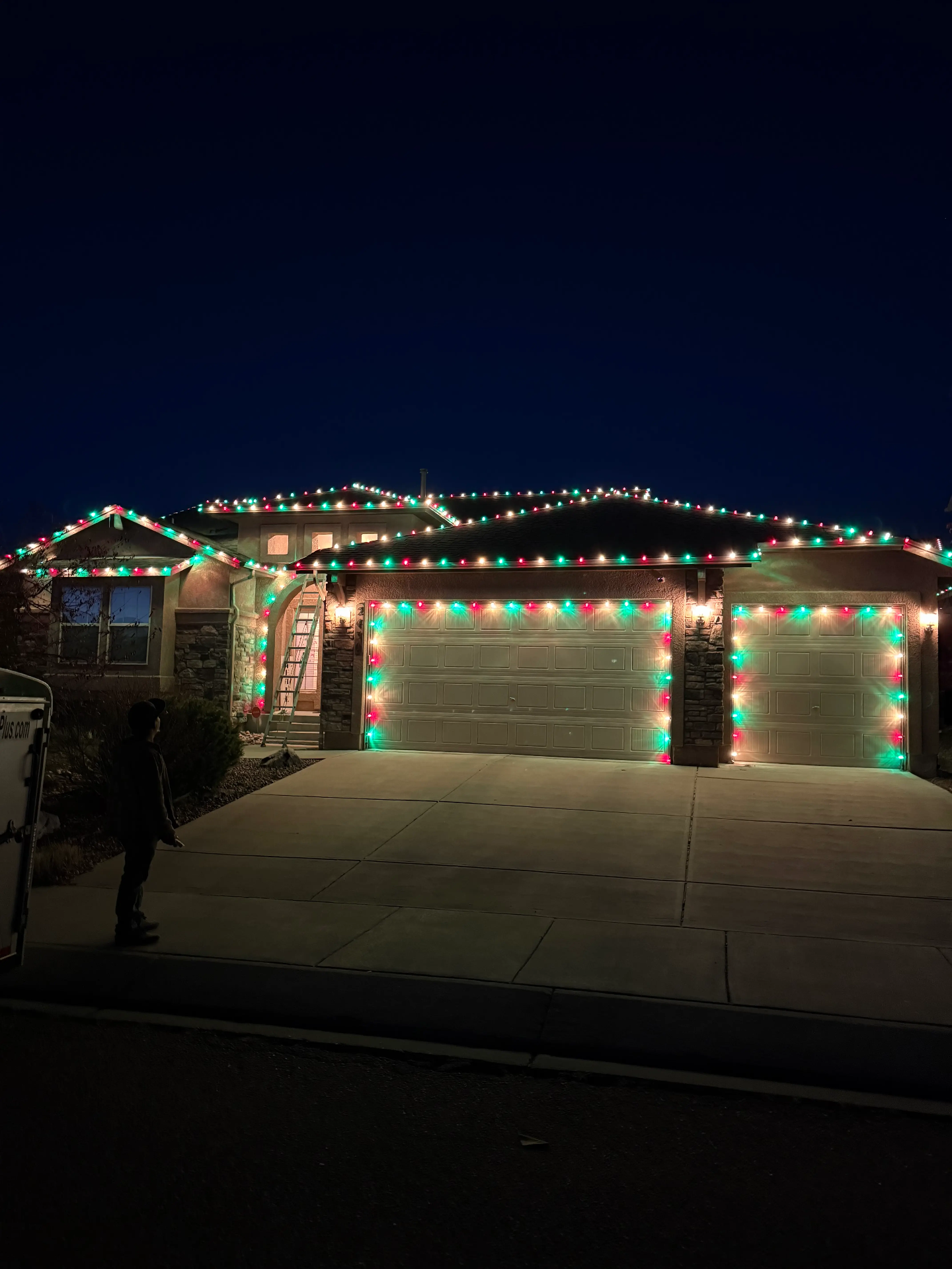 Front Range portfolio: red and green LED roofline and garage lighting on a residential home