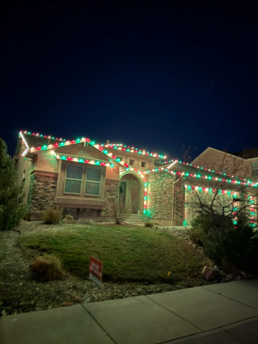 Front Range portfolio: multicolor LED roofline and landscape lighting on a two-story home