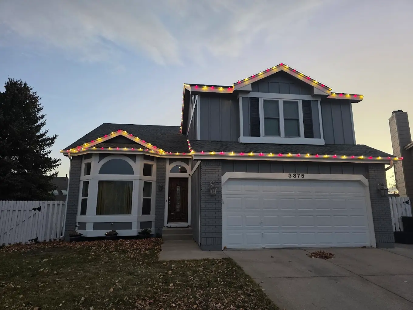 Front Range portfolio: multicolor C9 roofline lights on a two-story home